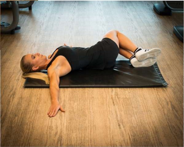 Knees side to side lower back rotation stretch, knees lowered to one side