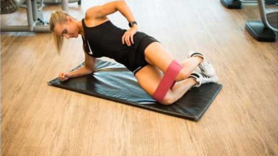Clam exercise with a resistance band, knee lifted