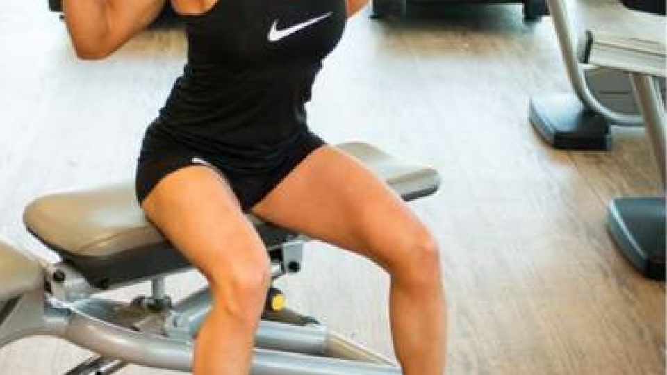 Box squat with a barbell, sitting back onto a bench